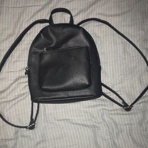A mini backpack. Never used it once!